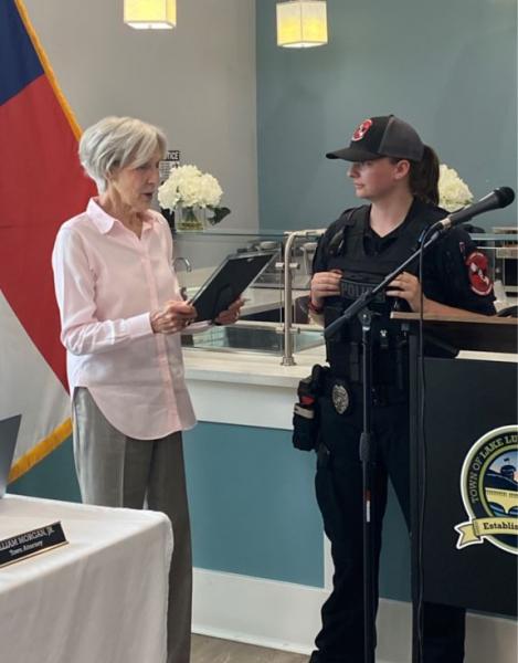Mayor Pritchett presents proclamation to officer Kortney Burrell