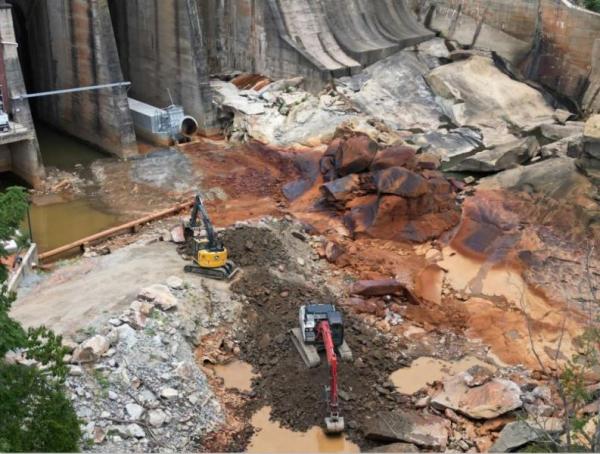 Public Works removing rocks below the dam