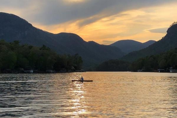 sunset in lake lure with boat