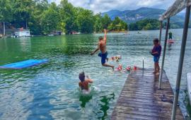Kids jumping off a dock into Lake Lure