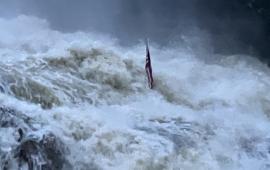 Hurricane Helene behind the Dam with American Flag