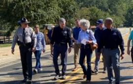 Mayor Pritchett with Gov Cooper and others touring Lake Lure