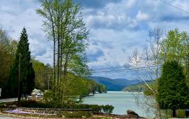 Welcome to Lake Lure Sign with Lake in Background