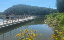Floating Boardwalk with People Walking on it.