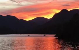 Gorgeous landscape sunset over the lake over the lake by Tom Cox