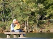 Couple on bench in the fall
