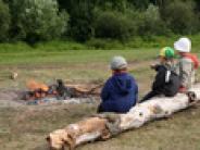Kids around a campfire