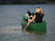Lady in Canoe on Lake