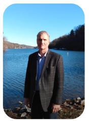 Town Engineer Kurt Wright standing in front of the water