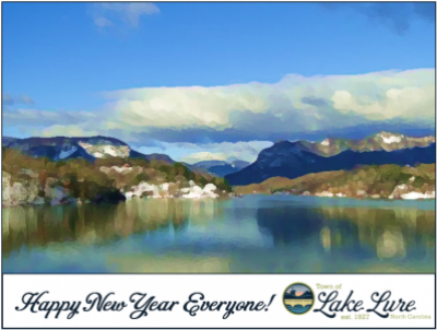 Lake and hills with text under that reads Happy New Year Everyone! Lake Lure