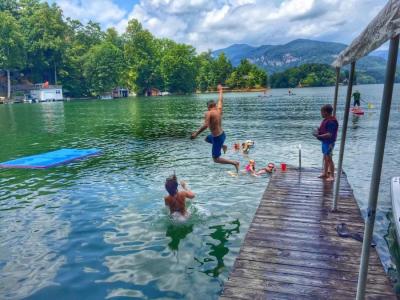 Kids jumping off a dock into Lake Lure