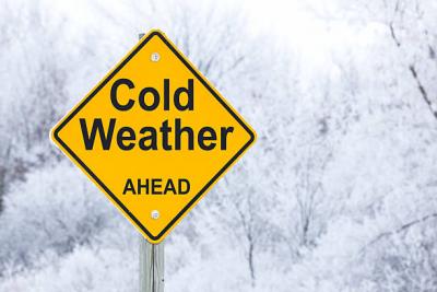 Cold Weather Ahead Sign. Rested by James Brey - Credit Getty Images
