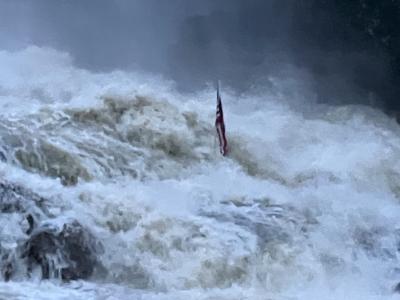 Hurricane Helene behind the Dam with American Flag