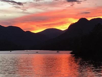 Gorgeous landscape sunset over the lake over the lake by Tom Cox