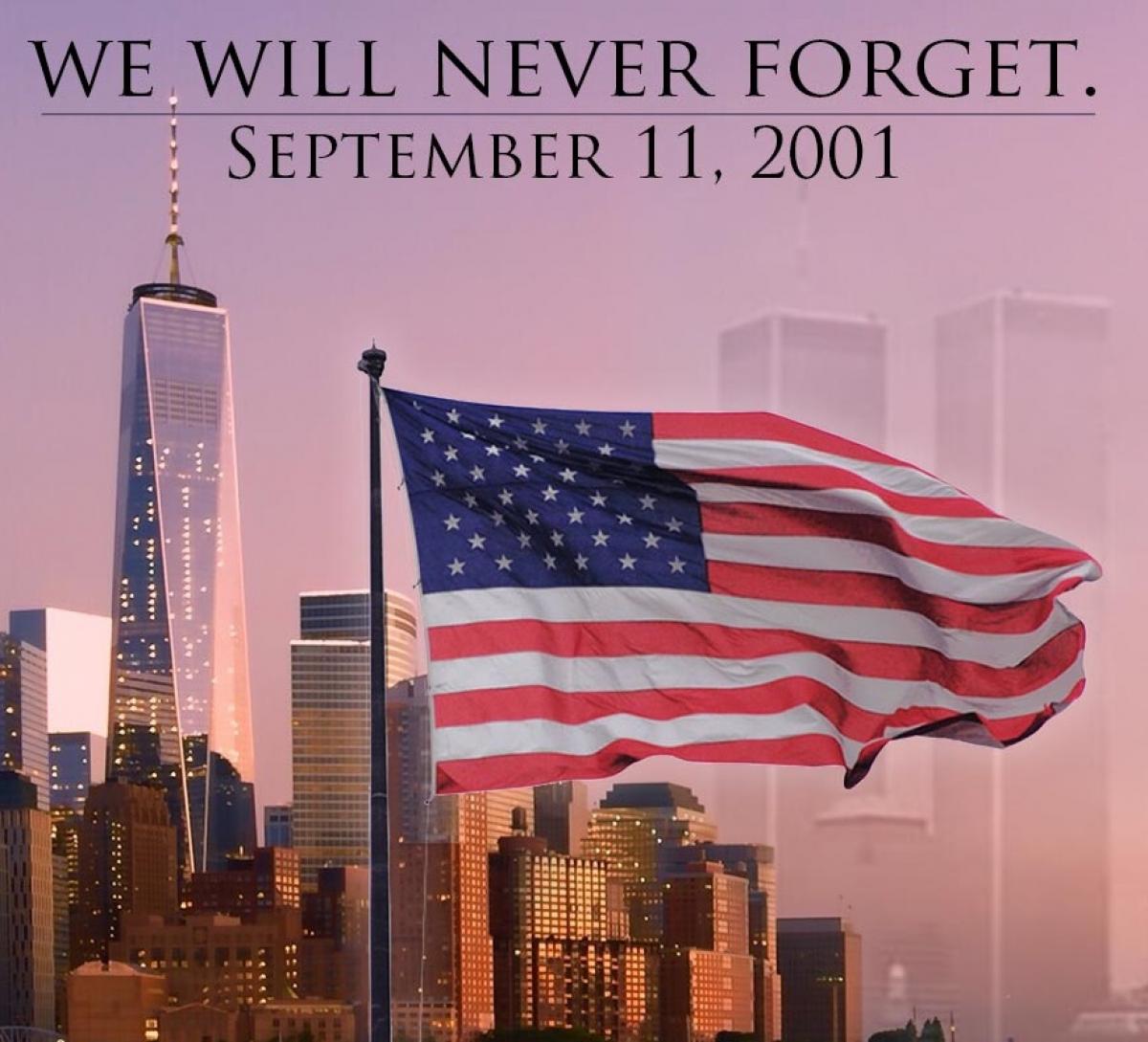 We Will Never Forget with NT City in background and American Flag in front.  